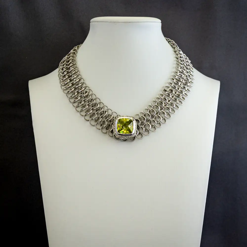 16-inch necklace features a band of intricately intertwined smooth and textured silver-tone rings.