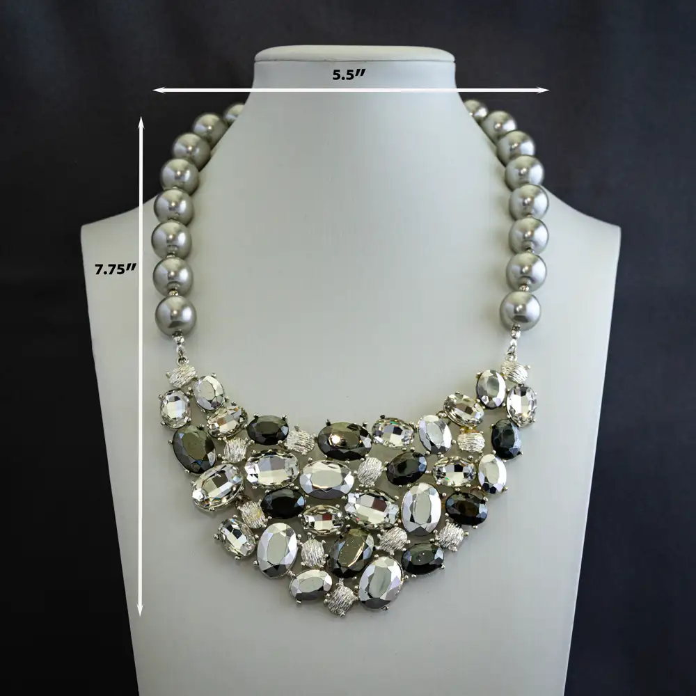 Dimensions of a 17.5-inch necklace with a magnificent 5-inch-wide vintage bib-style pendant.