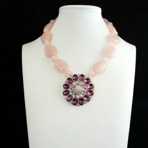 statement necklace. Soft, opaque rose quartz beads rhythmically alternate in 10mm and 18mm sizes for dynamic, eye-catching dimension.