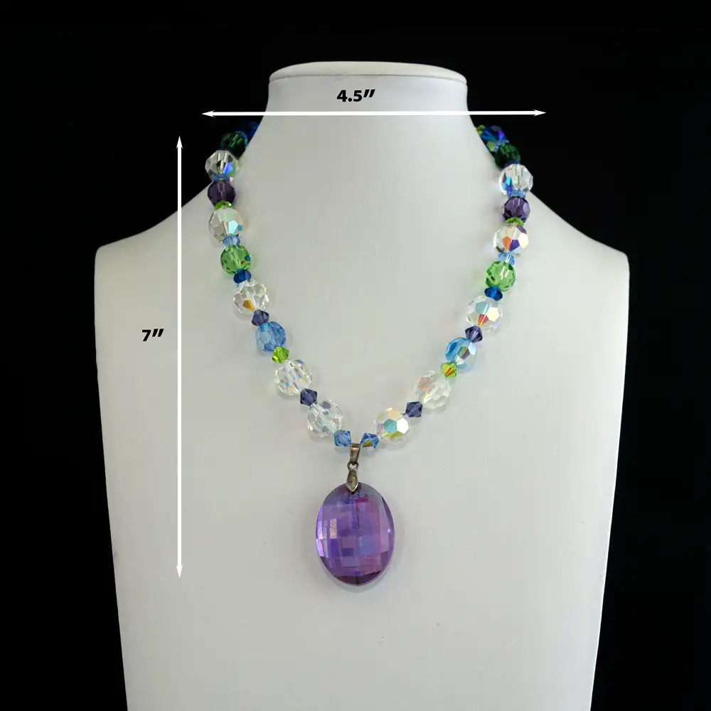 Description of A sparkling strand of vintage faceted crystal beads of 6mm, 10mm and 12mm features a mesmerizing blend of blue, green, purple, and clear hues.