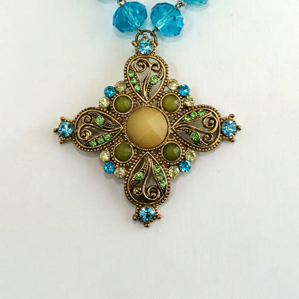close up of a handcrafted vintage statement piece with stunning 14mm hand-wired turquoise crystal stones