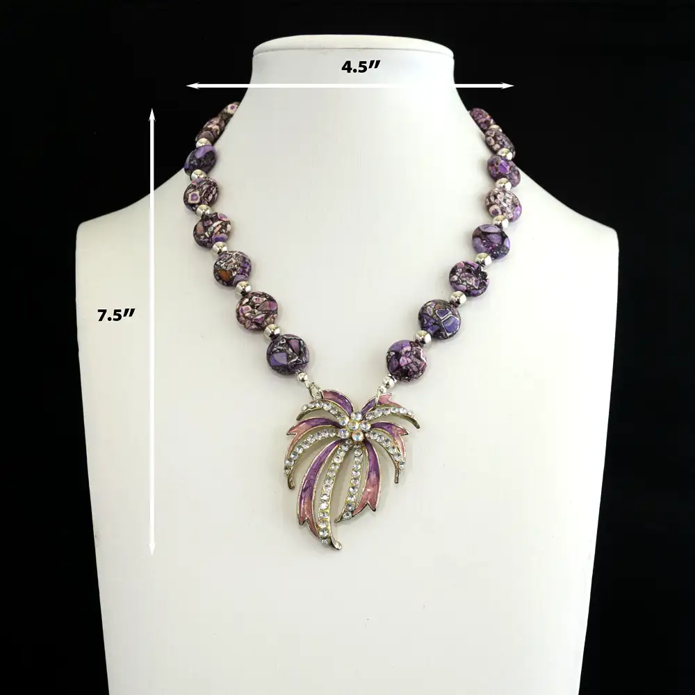 Vintage 13mm flat purple king cobra jasper stones alternate with sleek 5.5mm silver-tone spacers, creating a bold and captivating pattern.