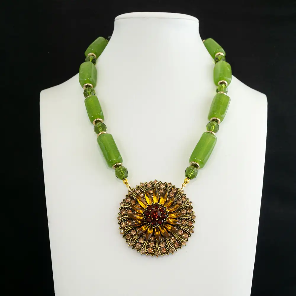 vintage necklace with a Large rectangular green glass stones pair seamlessly with 9mm faceted green glass beads, separated by warm gold-tone spacers for dynamic texture.