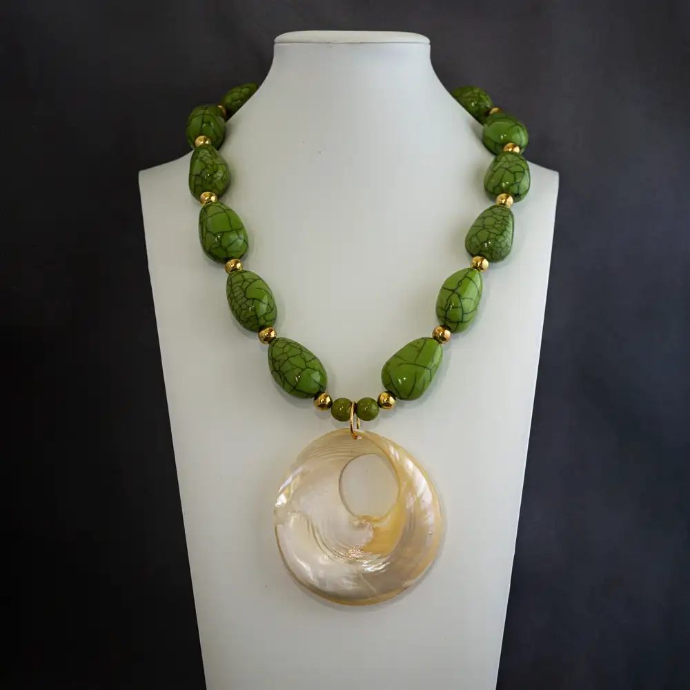 This vintage 20-inch necklace features a bold band of large, eye-catching apple green howlite stones.