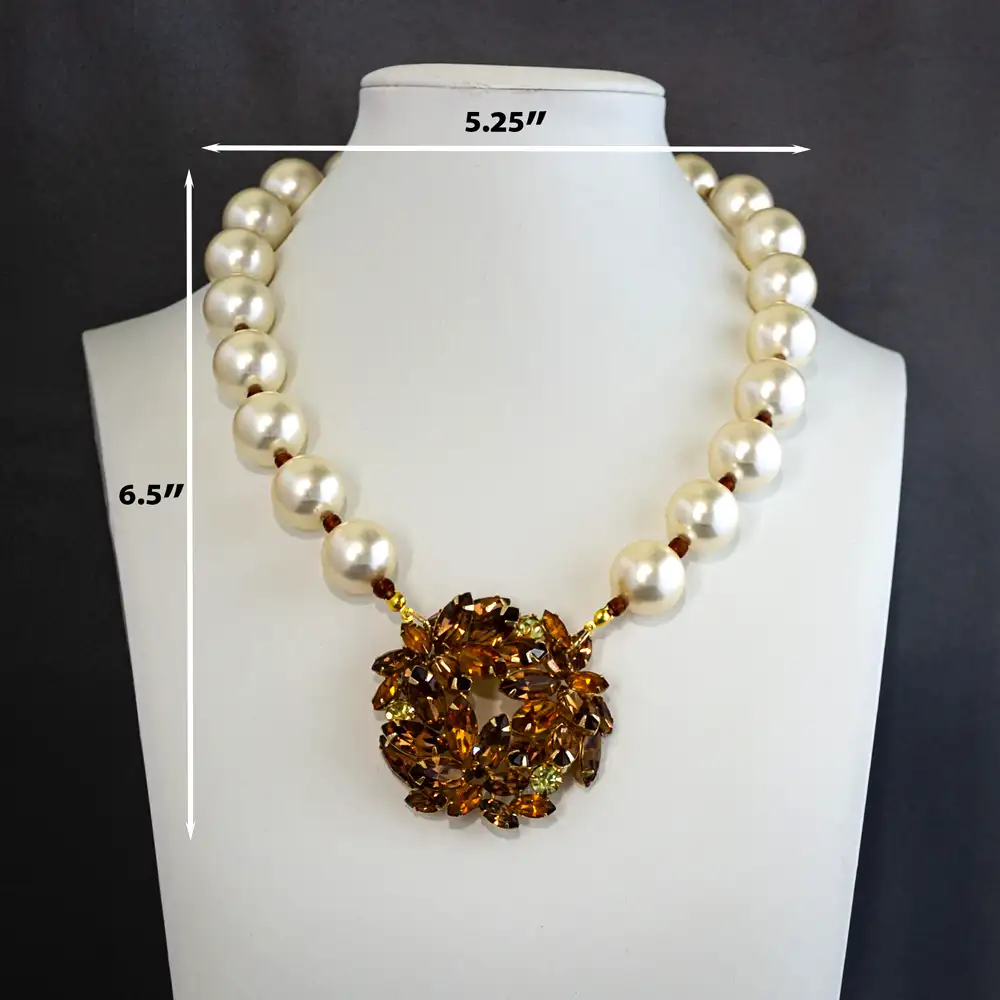 Description of exquisite vintage necklace, 12mm glass pearls is subtly separated by delicate gold-tone spacers.