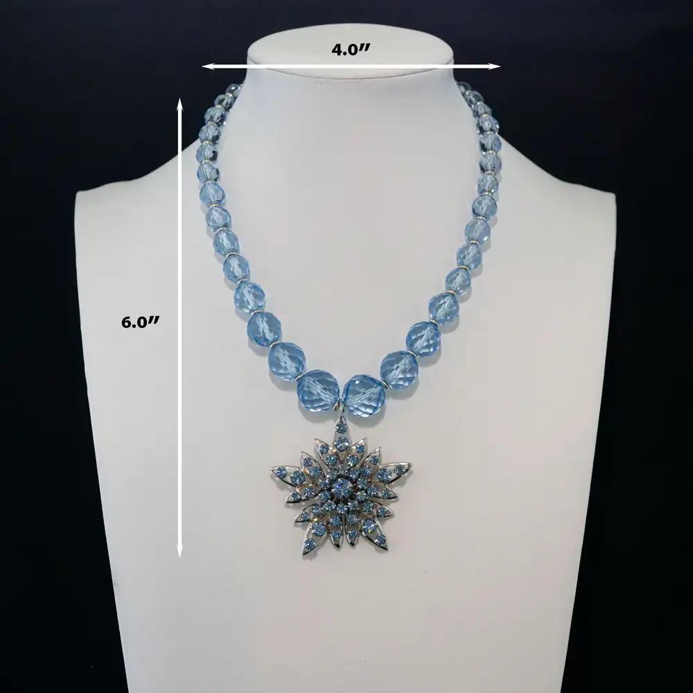 Description of a dazzling necklace features light blue faceted glass beads that catch the light from every angle.