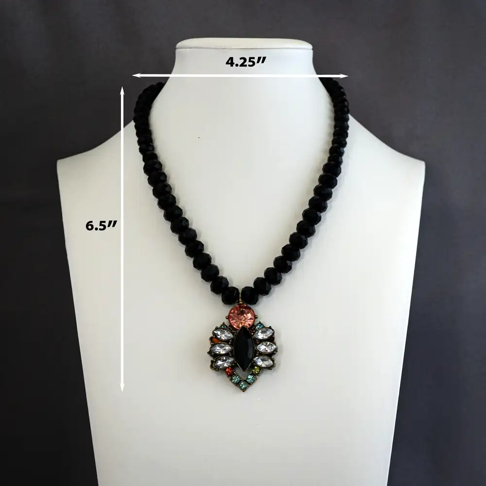 Dimensions of a vibrant vintage pendant measuring 1.25 inches wide by 1.5 inches long, this 15-inch necklace sparkles with clear, pink, turquoise, and chartreuse rhinestones
