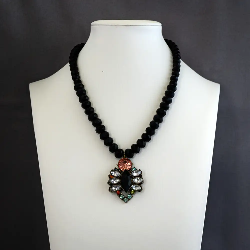 vibrant vintage pendant measuring 1.25 inches wide by 1.5 inches long, this 15-inch necklace sparkles with clear, pink, turquoise, and chartreuse rhinestones